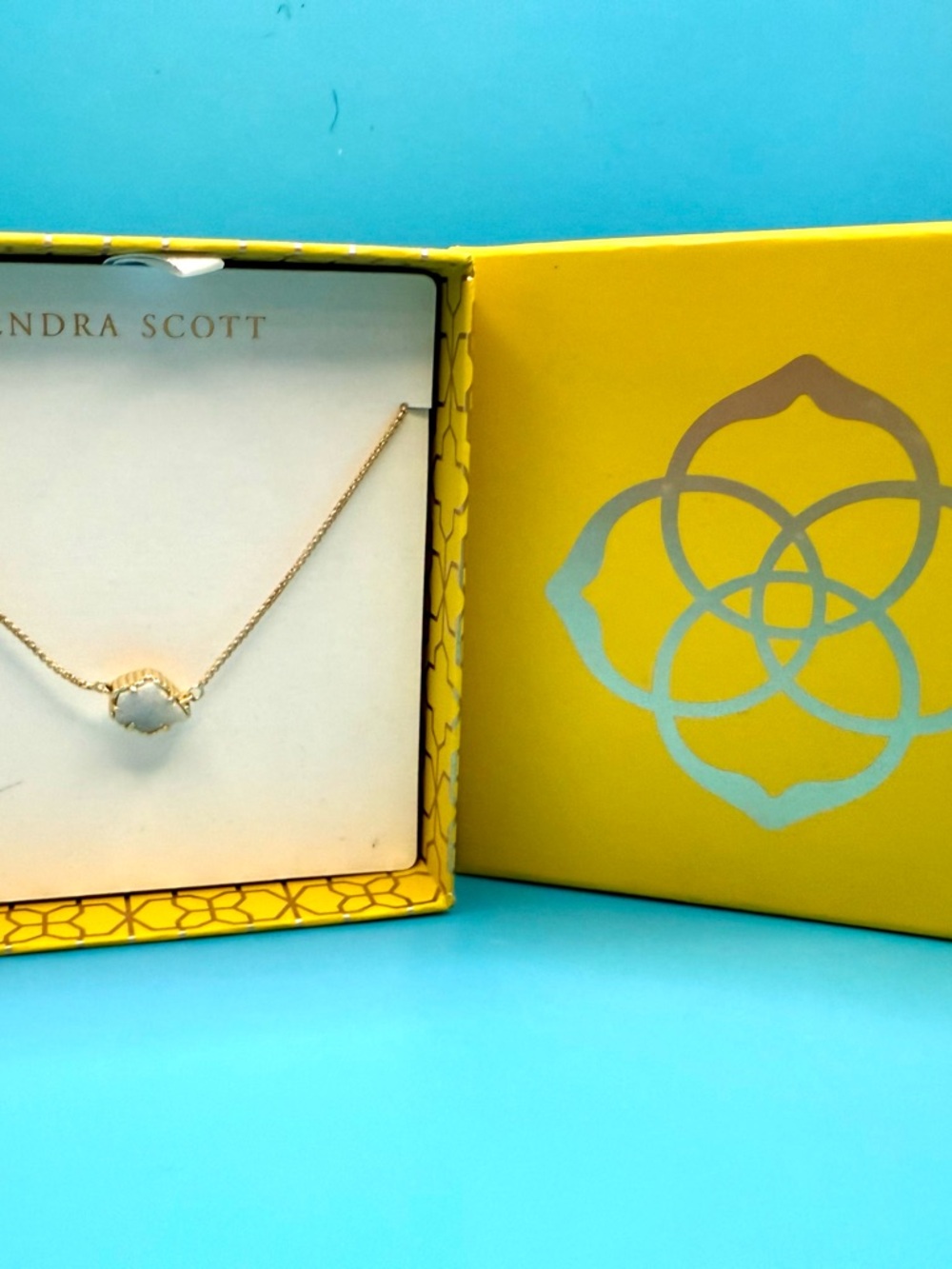 Kendra Scott Gold Necklace with Light Blue Stone
